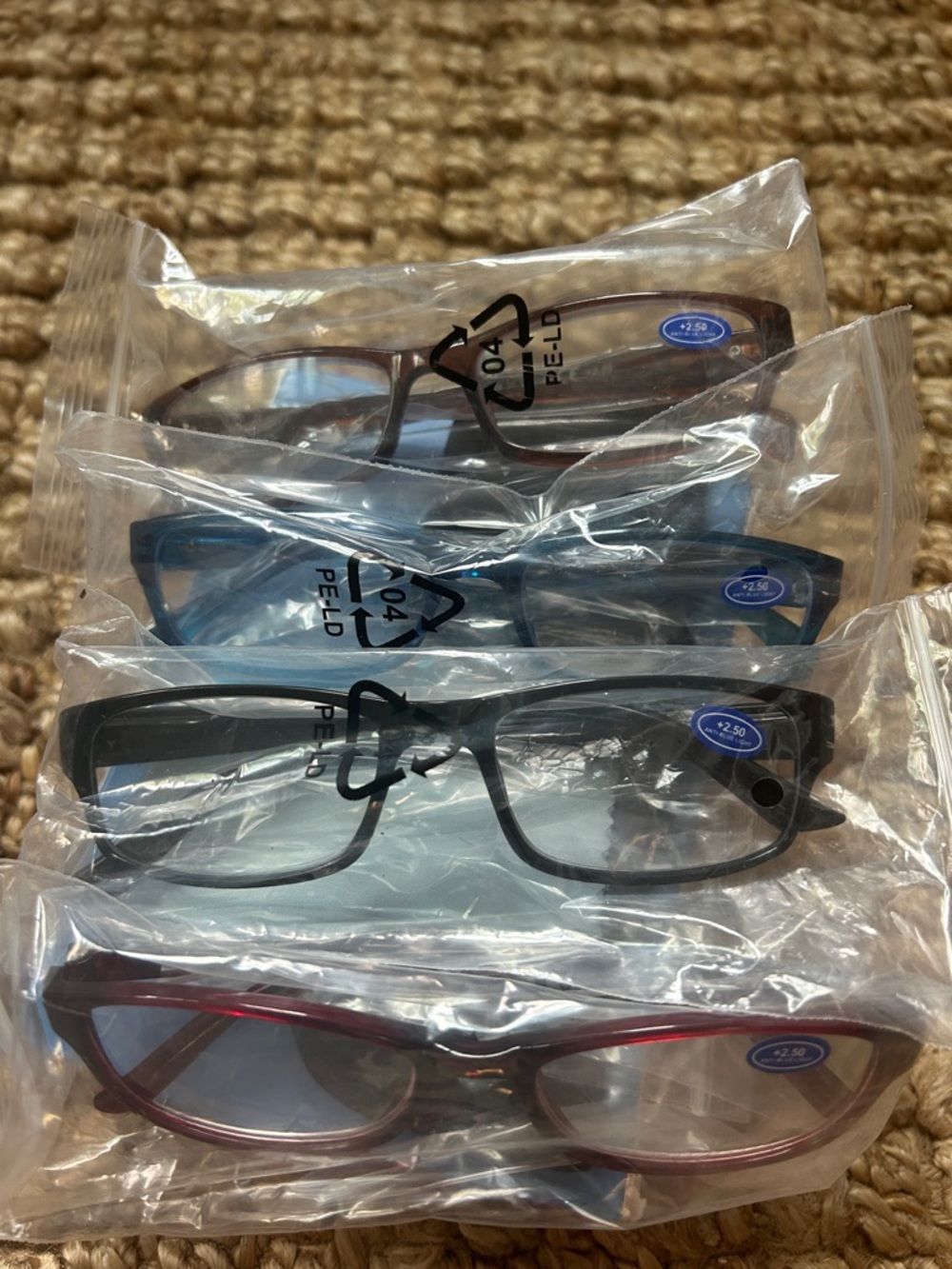 2.50 four pack reading glasses new with tags